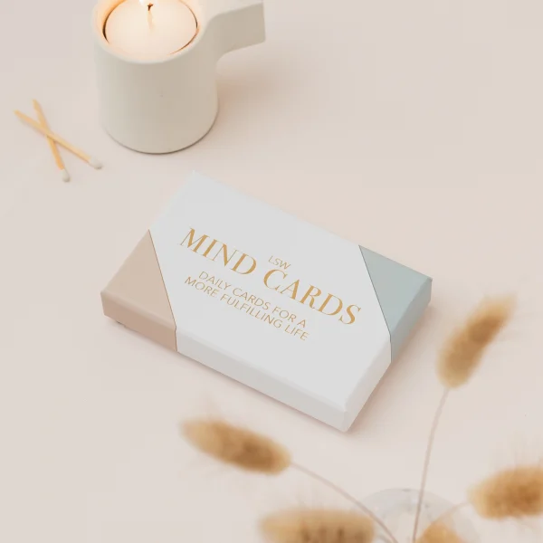 LSW Mind Cards box beside a lit candle and dried grasses